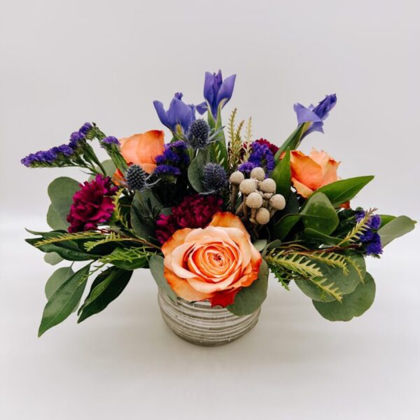 A vase filled with flowers on top of a table.