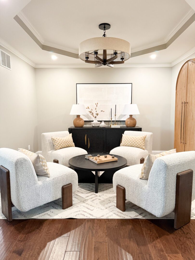 IMG_4717 A kitchen with a large island and chairs.