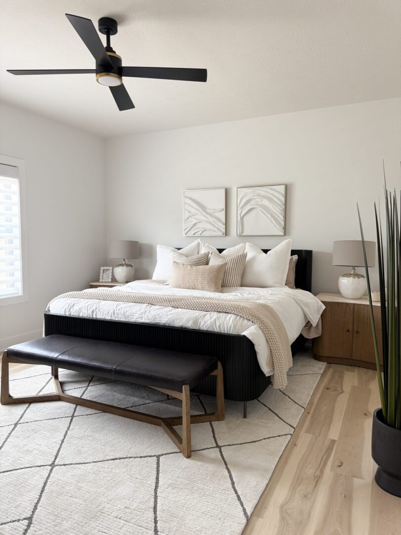 A kitchen with a large island and chairs.