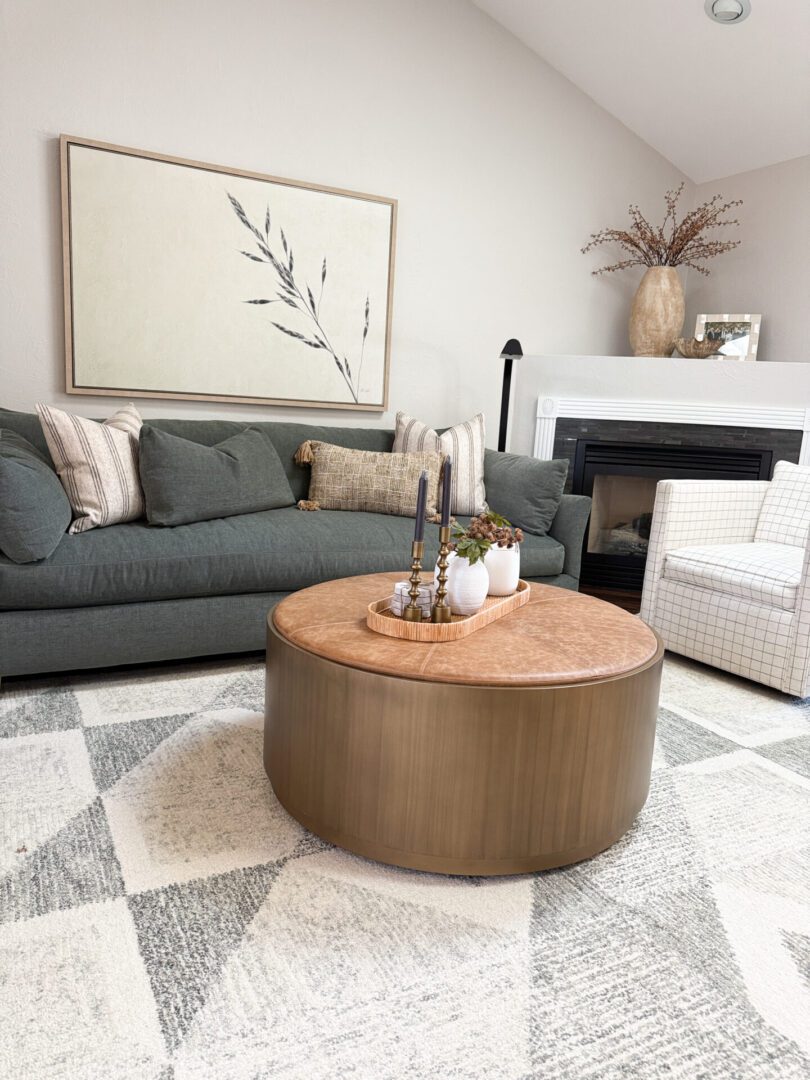 A kitchen with a large island and chairs.